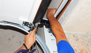 Specialist repairing garage door lining