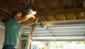 Specialist repairing garage door opener